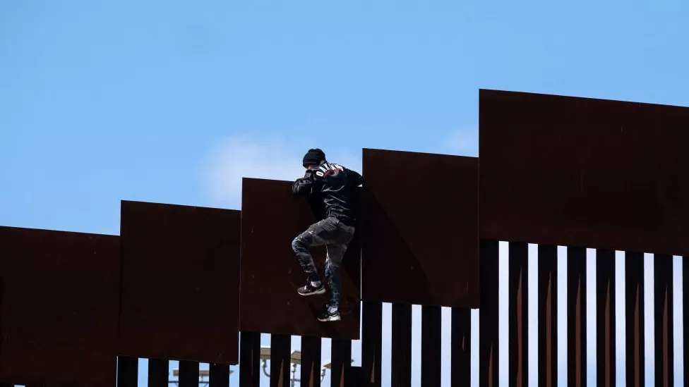President Biden expands Mexican border wall - but can it stop crossings?