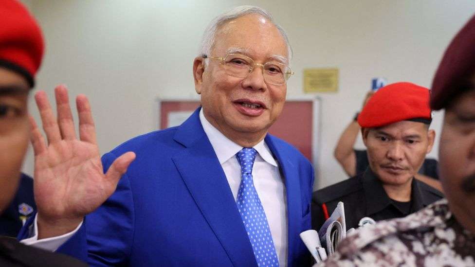 Malaysia halves ex-PM Najib Razak's jail term over 1MDB scandal