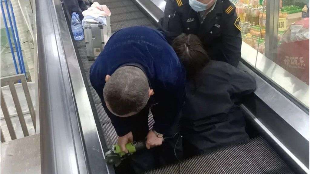 Woman hospitalised after falling through travelator in China
