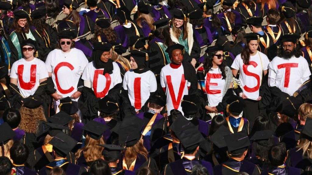 Virginia Commonwealth University students walk out of graduation