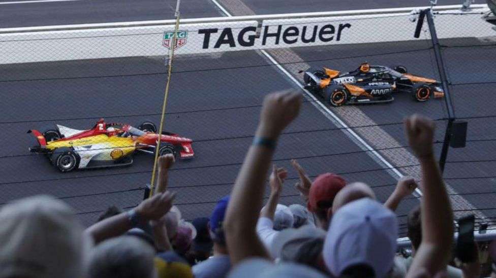 Newgarden wins storm-delayed Indy 500 on final lap