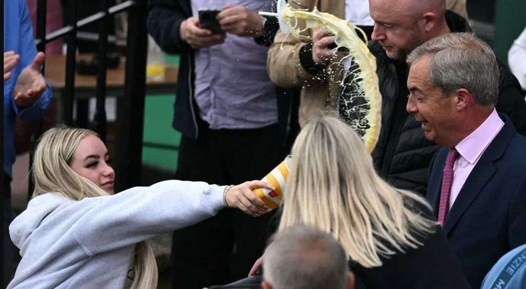 Woman charged after milkshake thrown over Farage