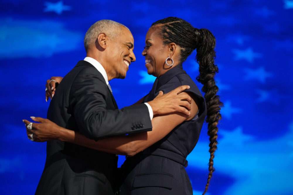 Barack and Michelle Obama electrify Democrats but warn of tight race