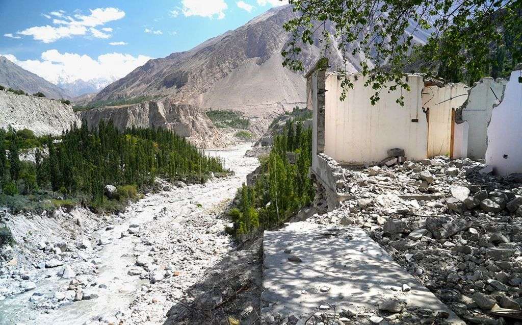 Melting glaciers leave homes teetering in valley of jagged mountains