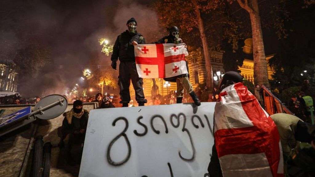 Georgia's PM hits back as protests and resignations intensify