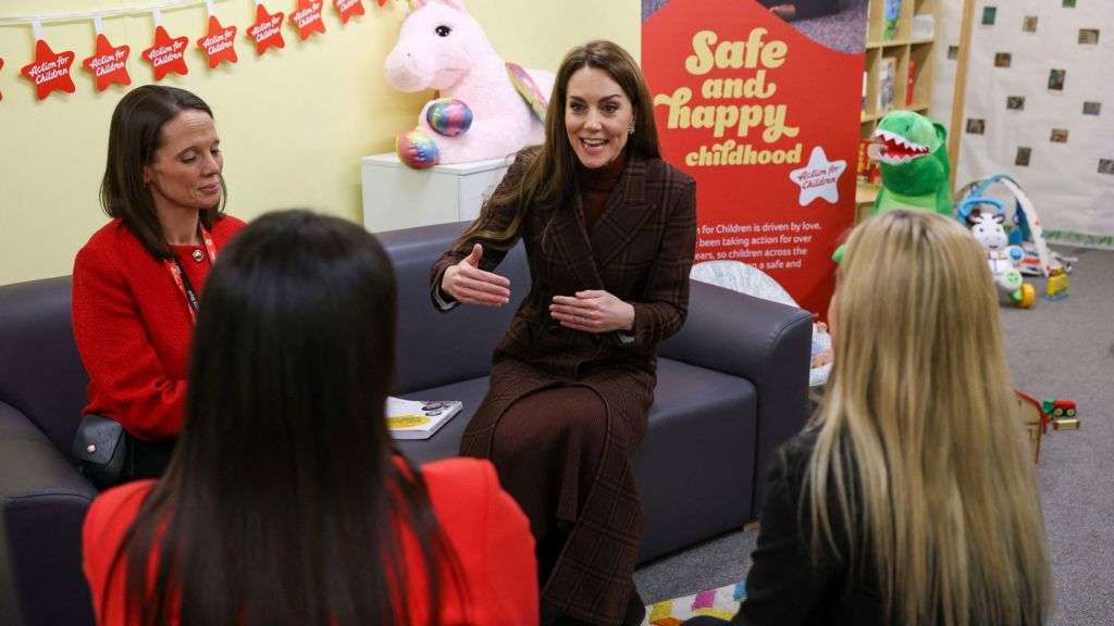 Kate meets new mothers and babies on prison visit