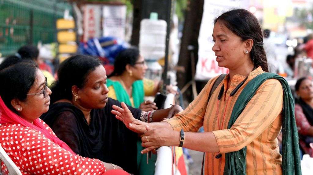 India's frontline health workers fight for better pay and recognition