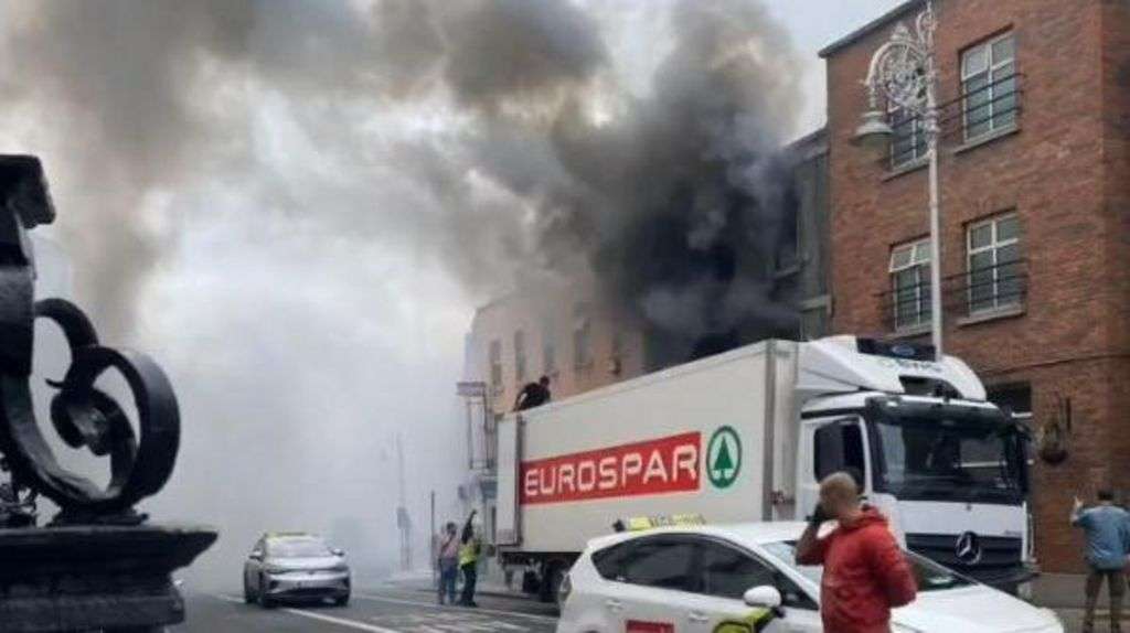 'Incredibly brave' lorry driver saves man from burning building